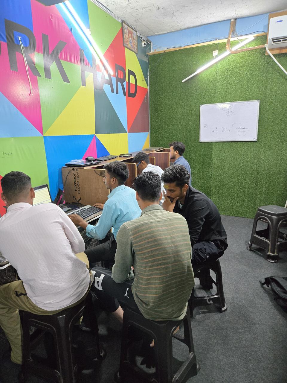 A batch of students working on computers during a practical class at VidyaTech